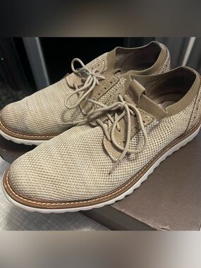 Brogue style soft sole tan dress shoes. Slip on. Mesh knit top fabric.